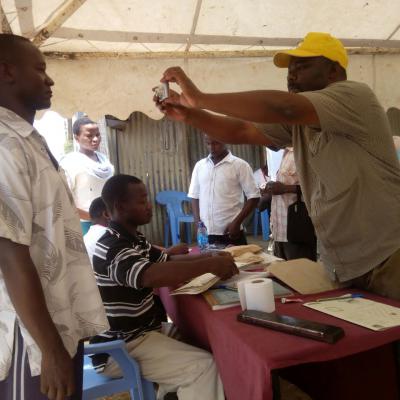 A Member Of Public Being Assisted By One Of The Kilifi Huduma Center Staff During The Event