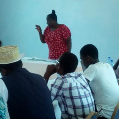 Madam Jelani Taking The Youth Leaders Through One Of The Training Sessions